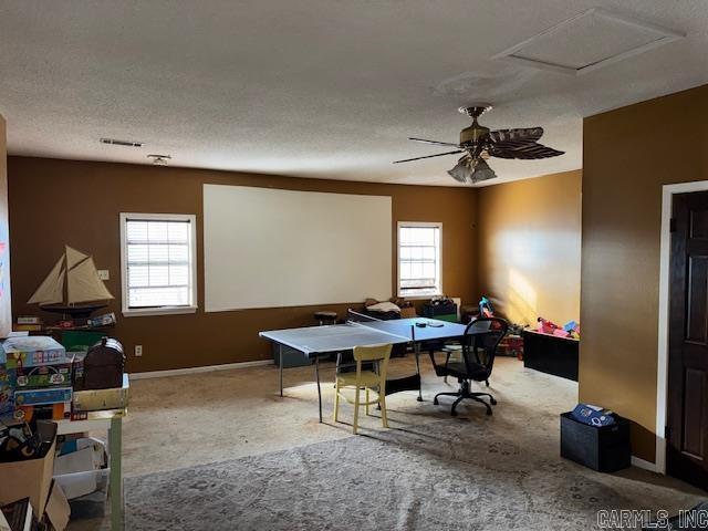 home office featuring a textured ceiling and ceiling fan