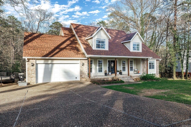 cape cod-style house featuring a front lawn, a porch, and a garage