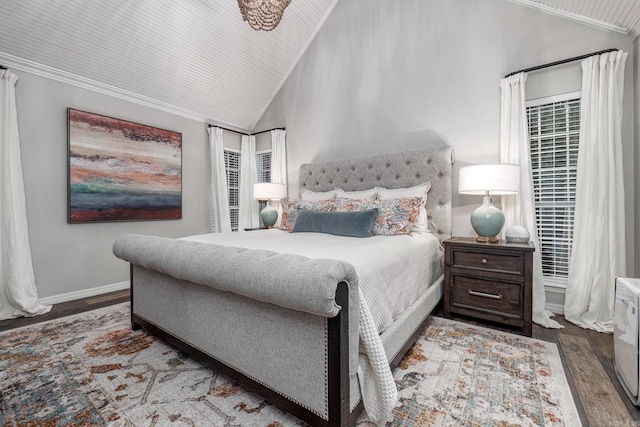 bedroom featuring crown molding, dark wood-type flooring, and vaulted ceiling