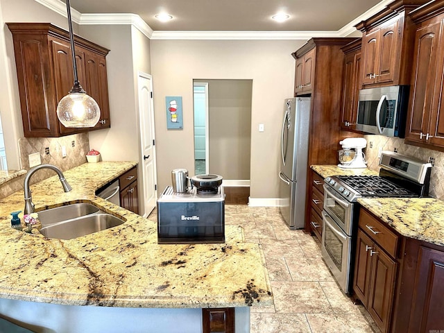 kitchen featuring appliances with stainless steel finishes, tasteful backsplash, crown molding, sink, and decorative light fixtures