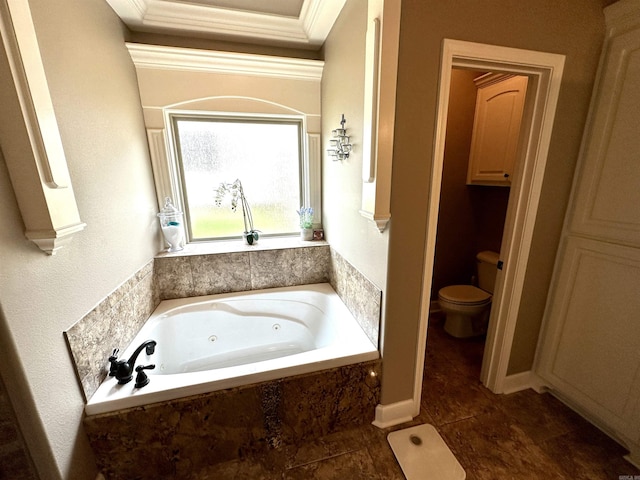 bathroom featuring tiled bath, toilet, and crown molding