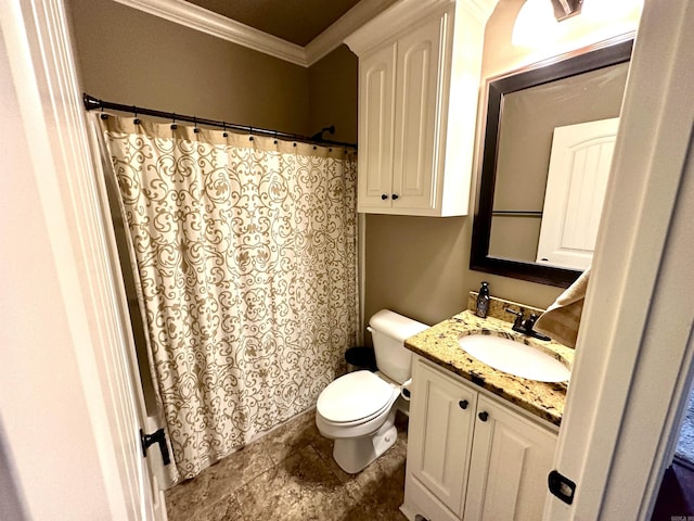 bathroom with vanity, toilet, and crown molding