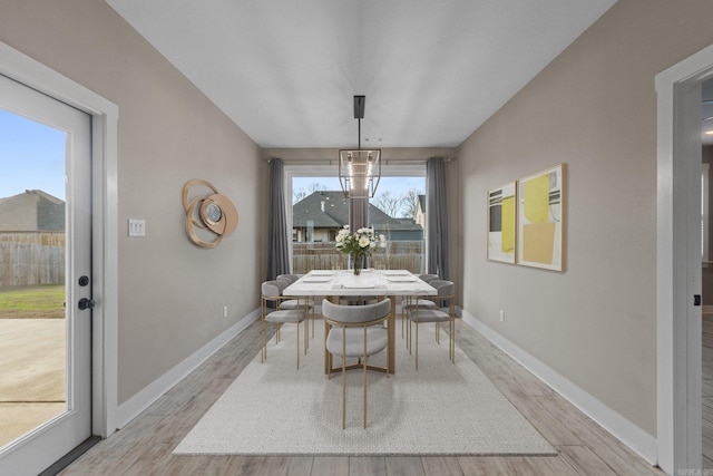 dining area featuring light hardwood / wood-style flooring and a healthy amount of sunlight