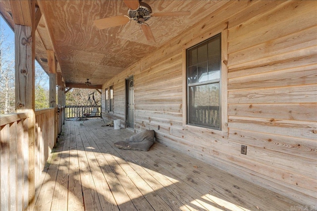 deck featuring ceiling fan and covered porch