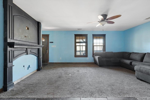 living room with carpet flooring and ceiling fan