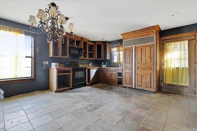 kitchen with black appliances, decorative light fixtures, a wealth of natural light, and a notable chandelier