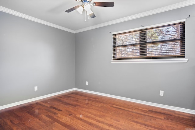 empty room with ceiling fan, crown molding, and hardwood / wood-style flooring