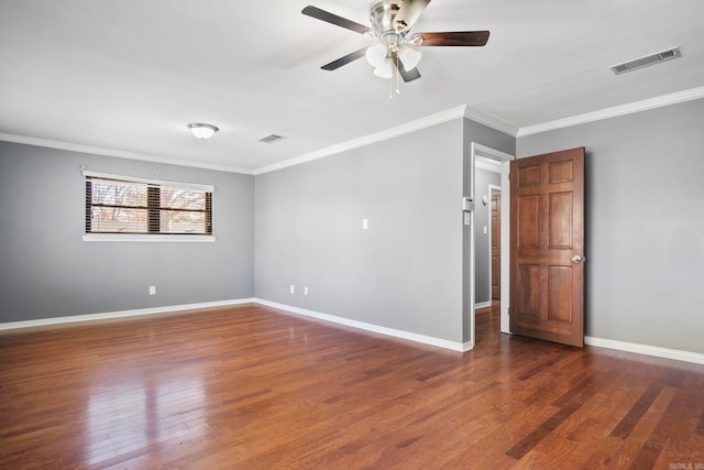 unfurnished room featuring dark hardwood / wood-style flooring, ceiling fan, and ornamental molding