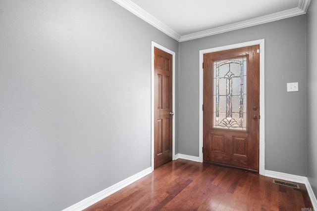 foyer with crown molding and dark hardwood / wood-style floors