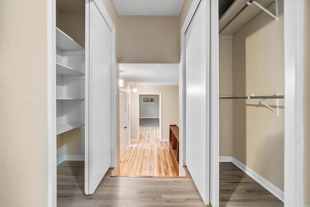 hallway featuring hardwood / wood-style flooring