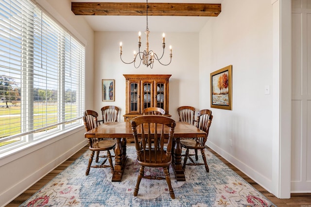 dining area featuring beamed ceiling, dark wood-type flooring, and an inviting chandelier