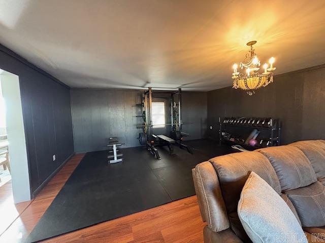 interior space with hardwood / wood-style flooring and a notable chandelier