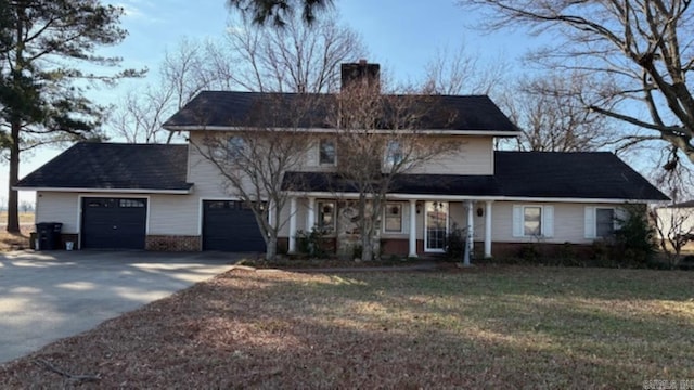 view of front of house featuring a front yard and a garage