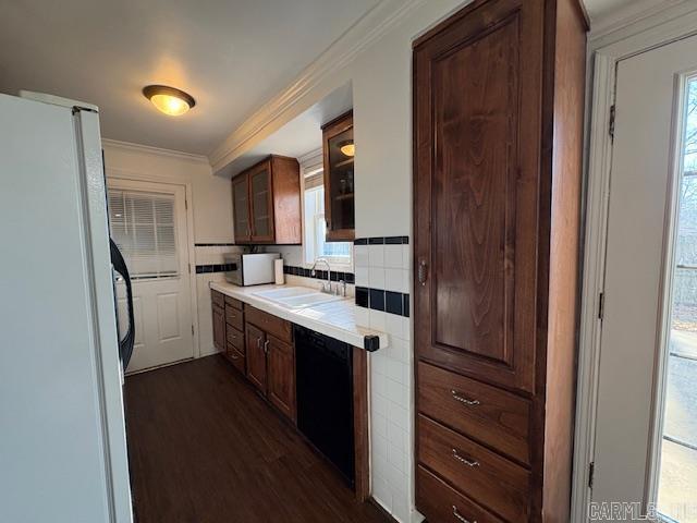 kitchen featuring white appliances, crown molding, sink, dark hardwood / wood-style floors, and tasteful backsplash