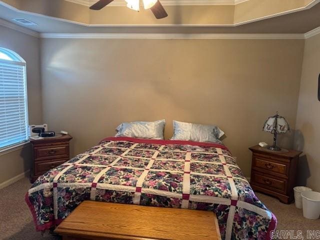 bedroom featuring multiple windows, carpet floors, ceiling fan, and crown molding