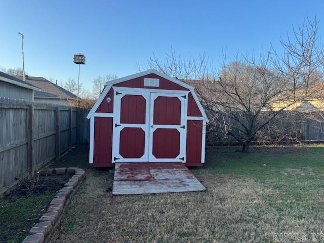 view of outdoor structure with a lawn