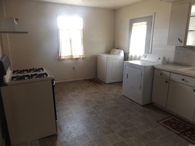 washroom featuring washing machine and dryer