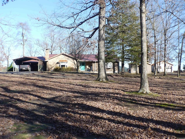 exterior space with a carport