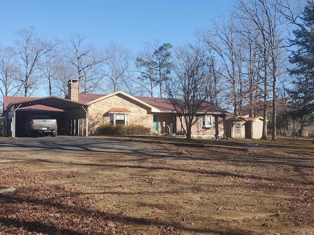 ranch-style house with a carport