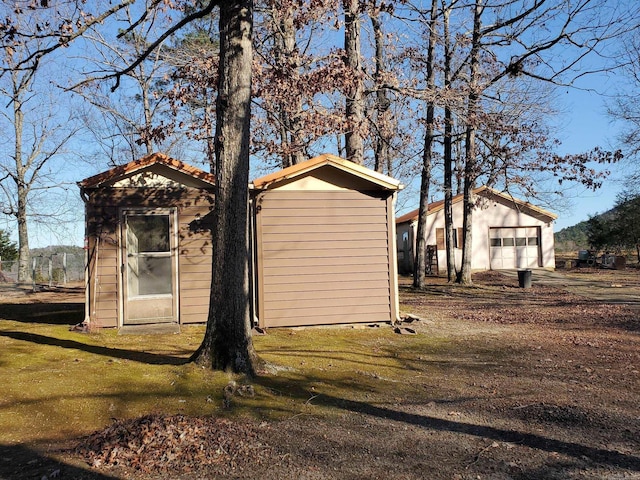 view of side of home featuring a garage