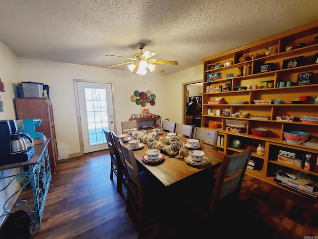 dining room featuring a textured ceiling, dark hardwood / wood-style flooring, and ceiling fan