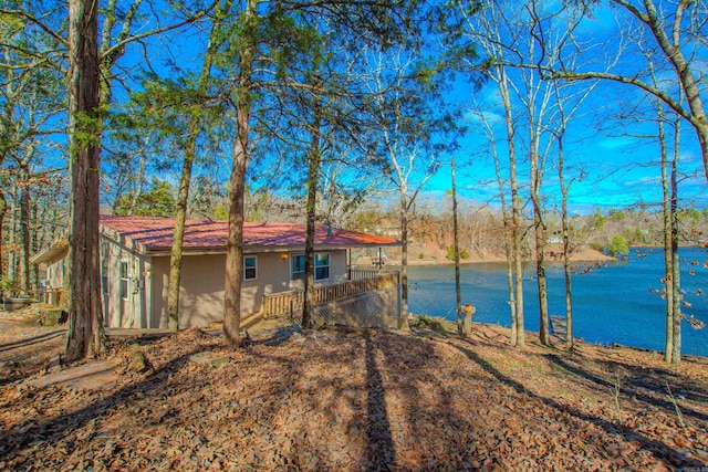 exterior space with a water view