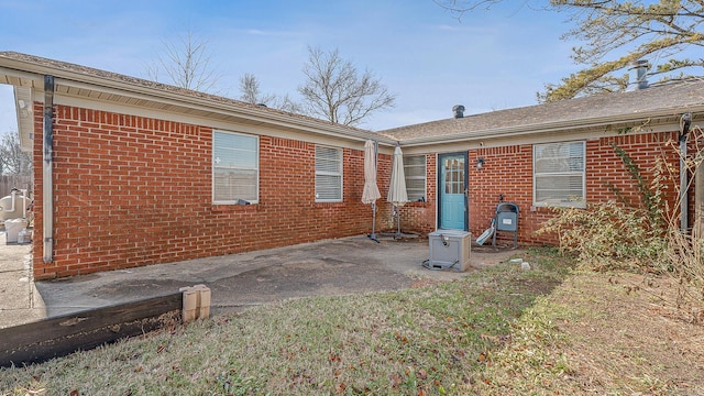 back of property with a patio