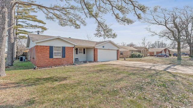 ranch-style home featuring a front yard, central AC unit, and a garage