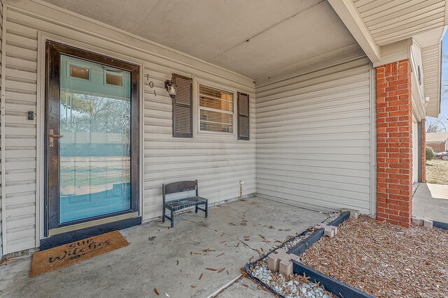 doorway to property featuring covered porch