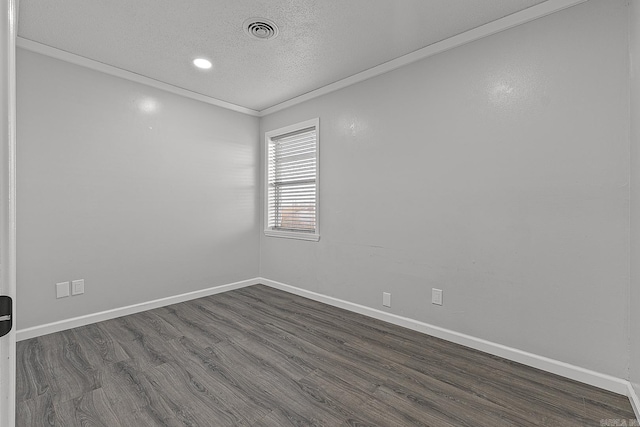 unfurnished room with a textured ceiling, crown molding, and dark wood-type flooring