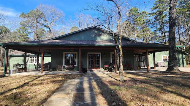 view of front facade with french doors and a patio