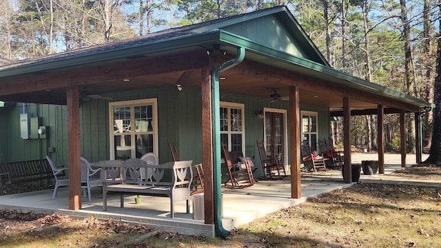 back of house with ceiling fan and a patio area