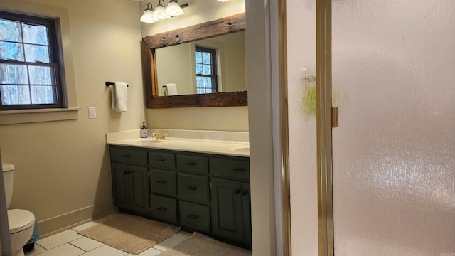 bathroom with tile patterned floors, walk in shower, vanity, and toilet