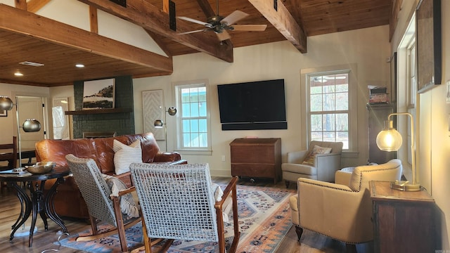 living room with ceiling fan, wood-type flooring, wooden ceiling, and a brick fireplace