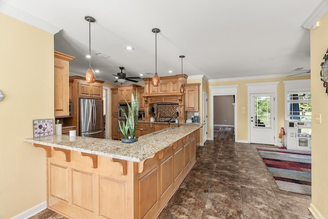 kitchen featuring ceiling fan, ornamental molding, decorative light fixtures, kitchen peninsula, and stainless steel appliances