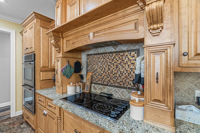 kitchen with multiple ovens, tasteful backsplash, light stone counters, black electric cooktop, and ornamental molding