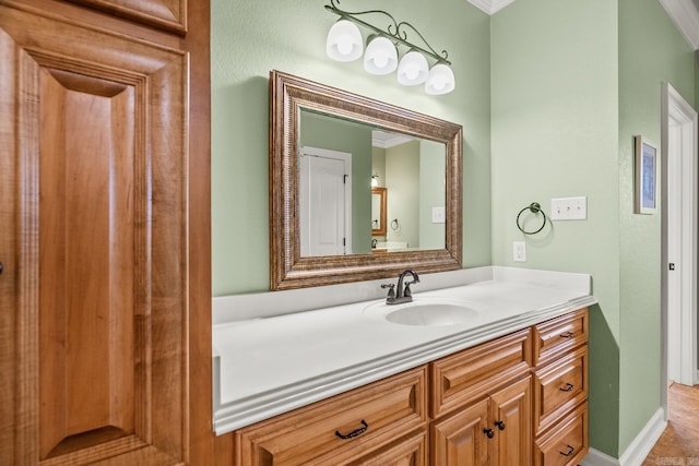 bathroom featuring vanity and crown molding