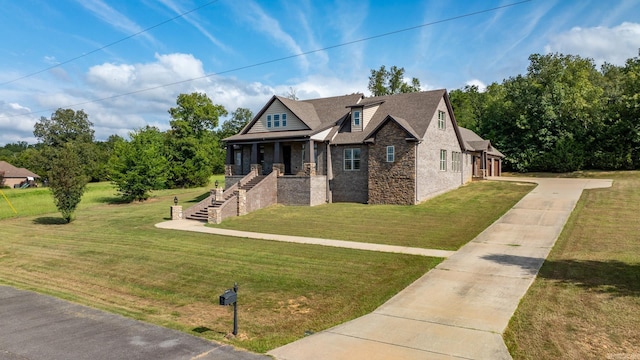 view of front of property with a porch and a front yard