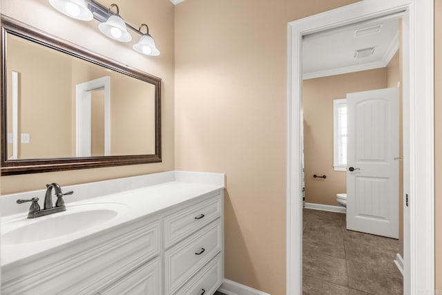 bathroom featuring crown molding, tile patterned flooring, vanity, and toilet