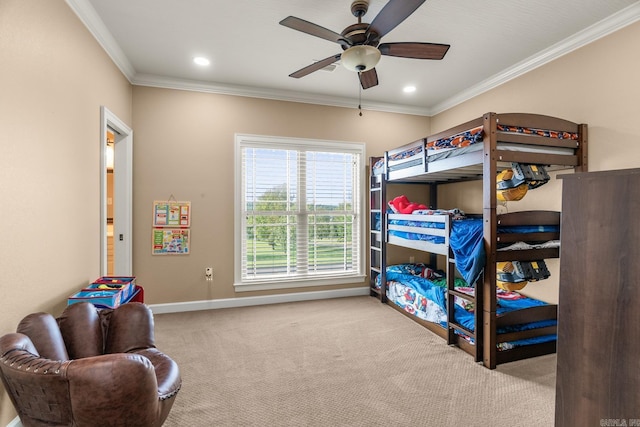 bedroom featuring ceiling fan, carpet, and ornamental molding