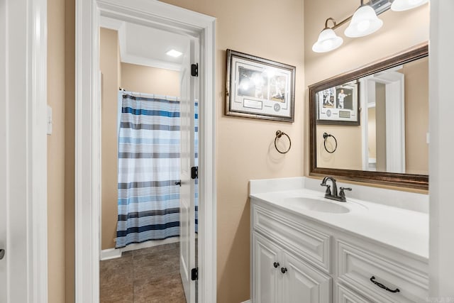 bathroom featuring crown molding, vanity, and a shower with shower curtain