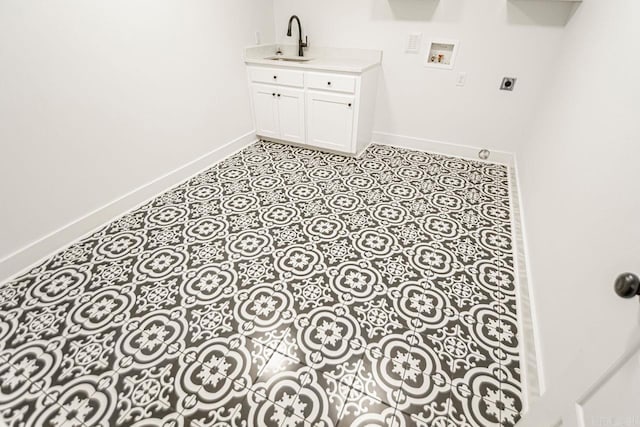 laundry room with hookup for a washing machine, electric dryer hookup, and sink