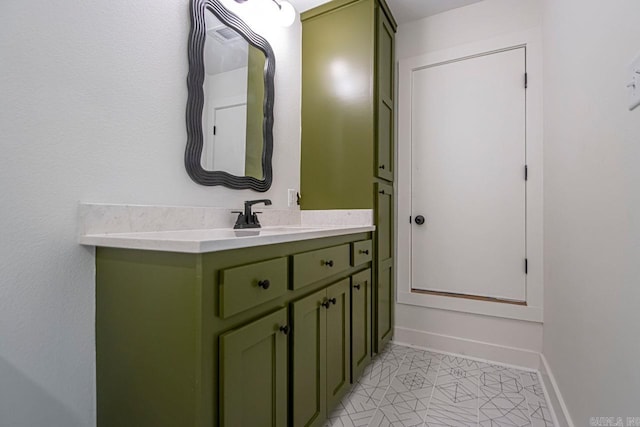 bathroom with tile patterned floors and vanity