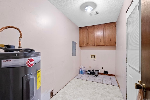 washroom with electric panel, water heater, cabinets, and a textured ceiling