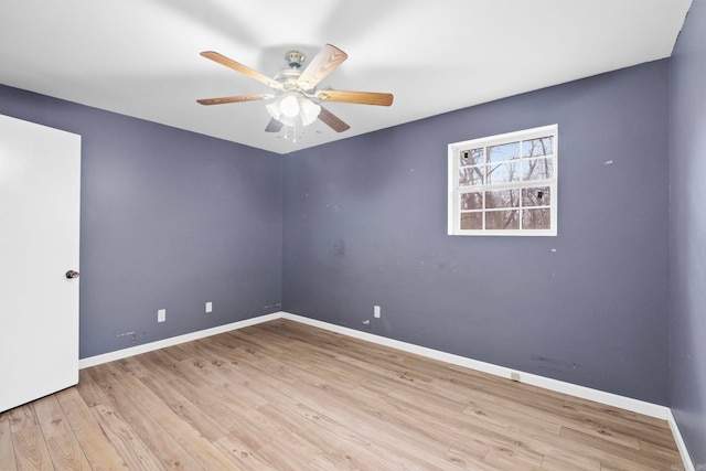 empty room featuring light wood-type flooring and ceiling fan