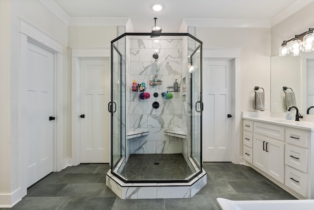 bathroom featuring a stall shower, crown molding, and vanity