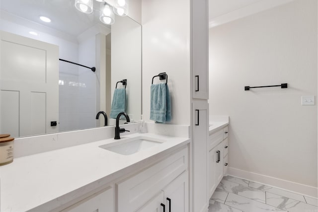 full bathroom with marble finish floor, recessed lighting, vanity, and baseboards