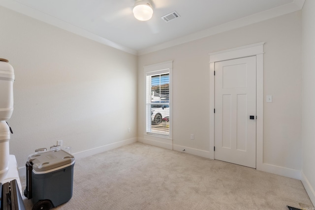 interior space featuring light carpet, baseboards, visible vents, and ornamental molding