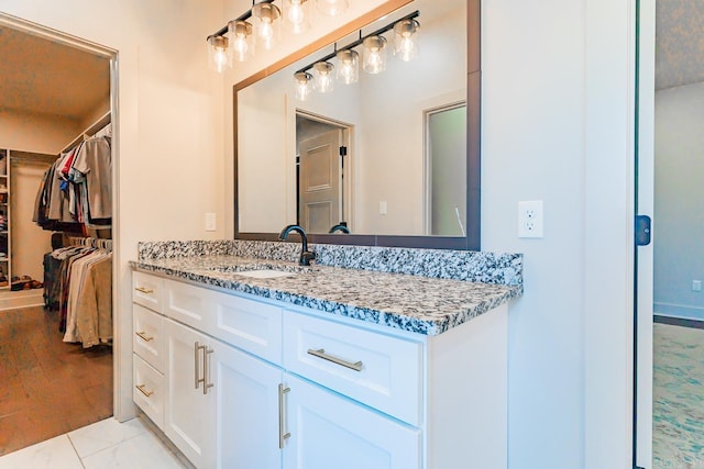 bathroom featuring tile patterned floors and vanity