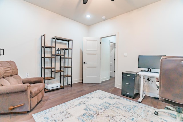 office with ceiling fan and dark hardwood / wood-style flooring